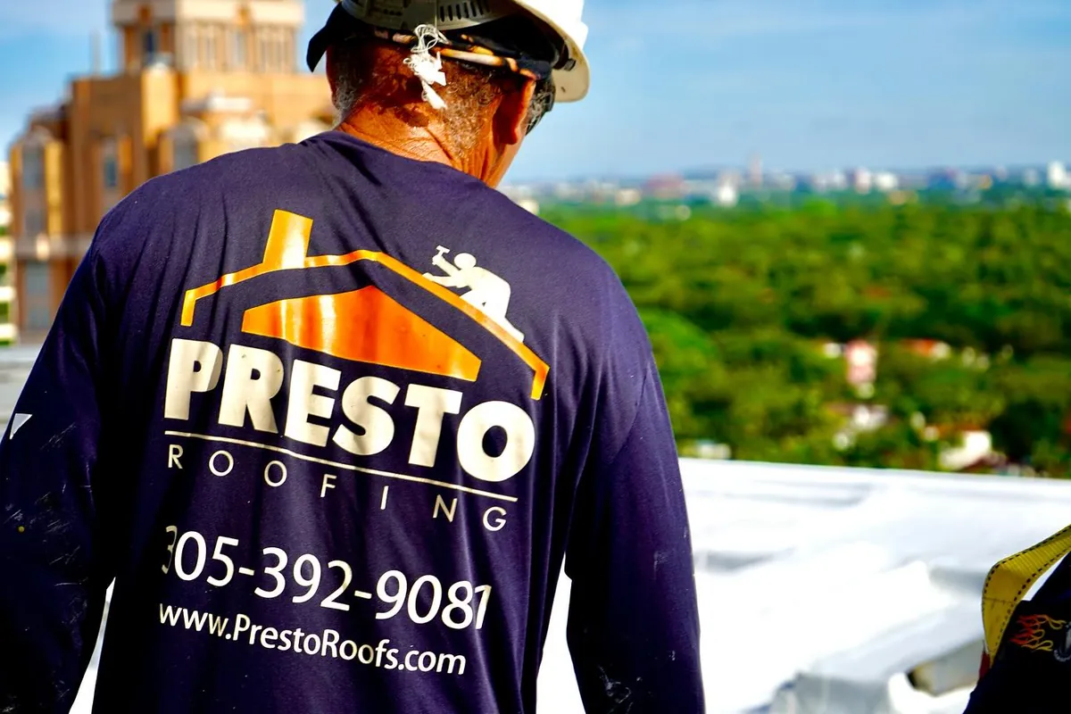 Veteran foreman on a high-rise project with Miami skyline behind